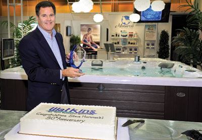 Company man: Watkins President Steve Hammock was honored for his 30 years of service at the firm’s booth at the International | Pool | Spa | Patio Expi in New Orleans.