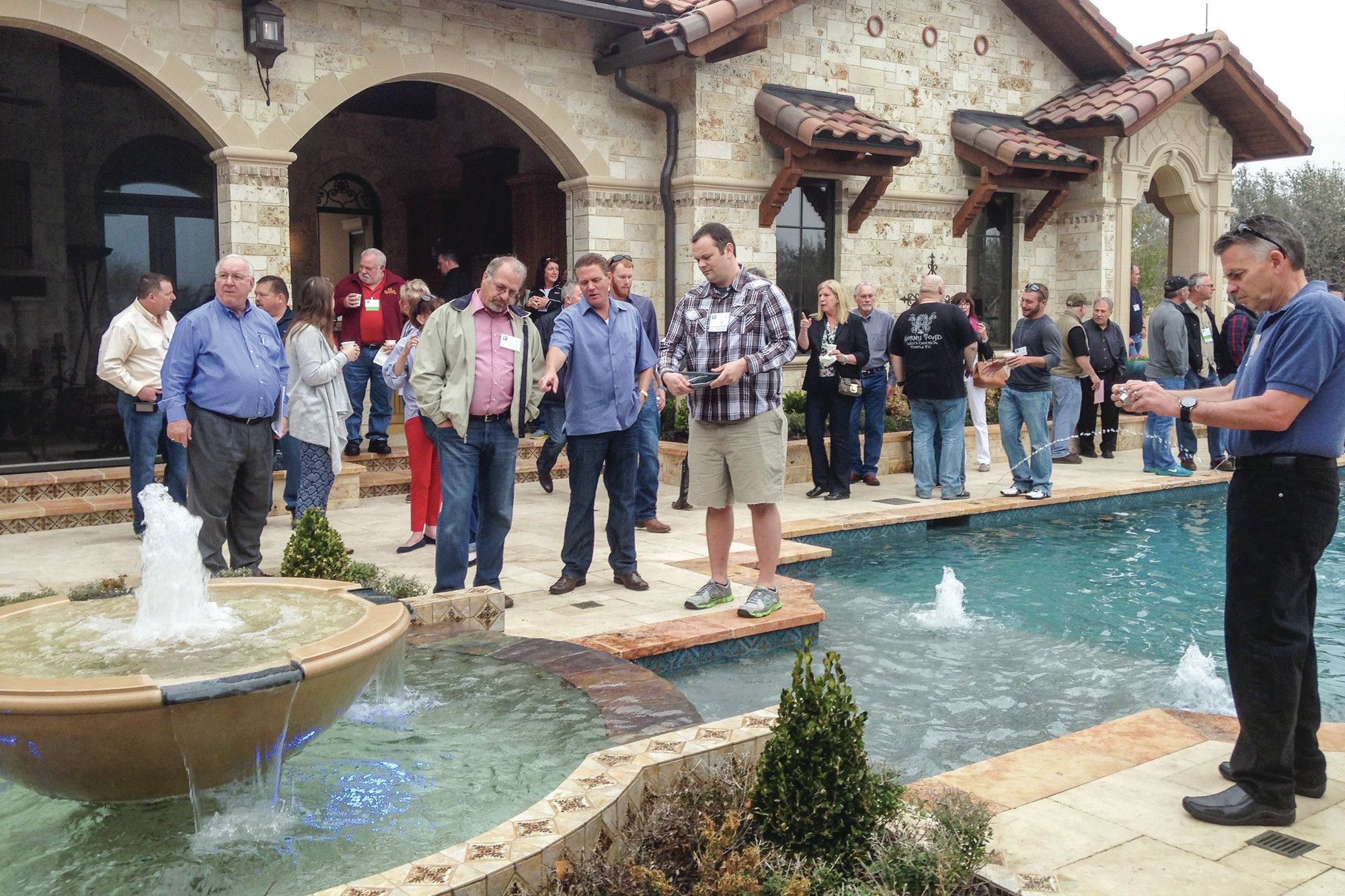 On display: Each of Master Pools’ twice-yearly meetings features a tour of waterscapes by local 

members. Here, professionals view and discuss one of three high-end projects by Claffey Pools of Southlake, Texas.
