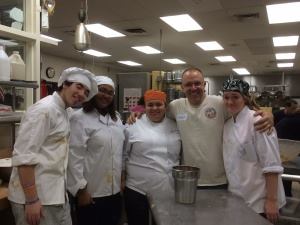 Frank Squeo, owner of Personalized Pool Care in Valley Village, NY, poses with volunteer bakers at BOCES of Rockland County where they'll produce more than 10,000 cookies an hour this holiday season.