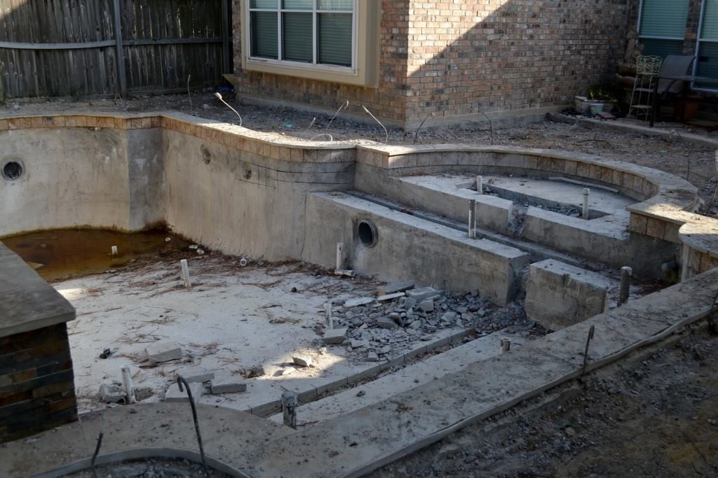 Pool undone: The Comeauxs’ installation before Cody Pools took it on. The rubble is from Bellar Pools’ attempt to saw the floor so crews could lay plumbing that had not been placed, sources said.