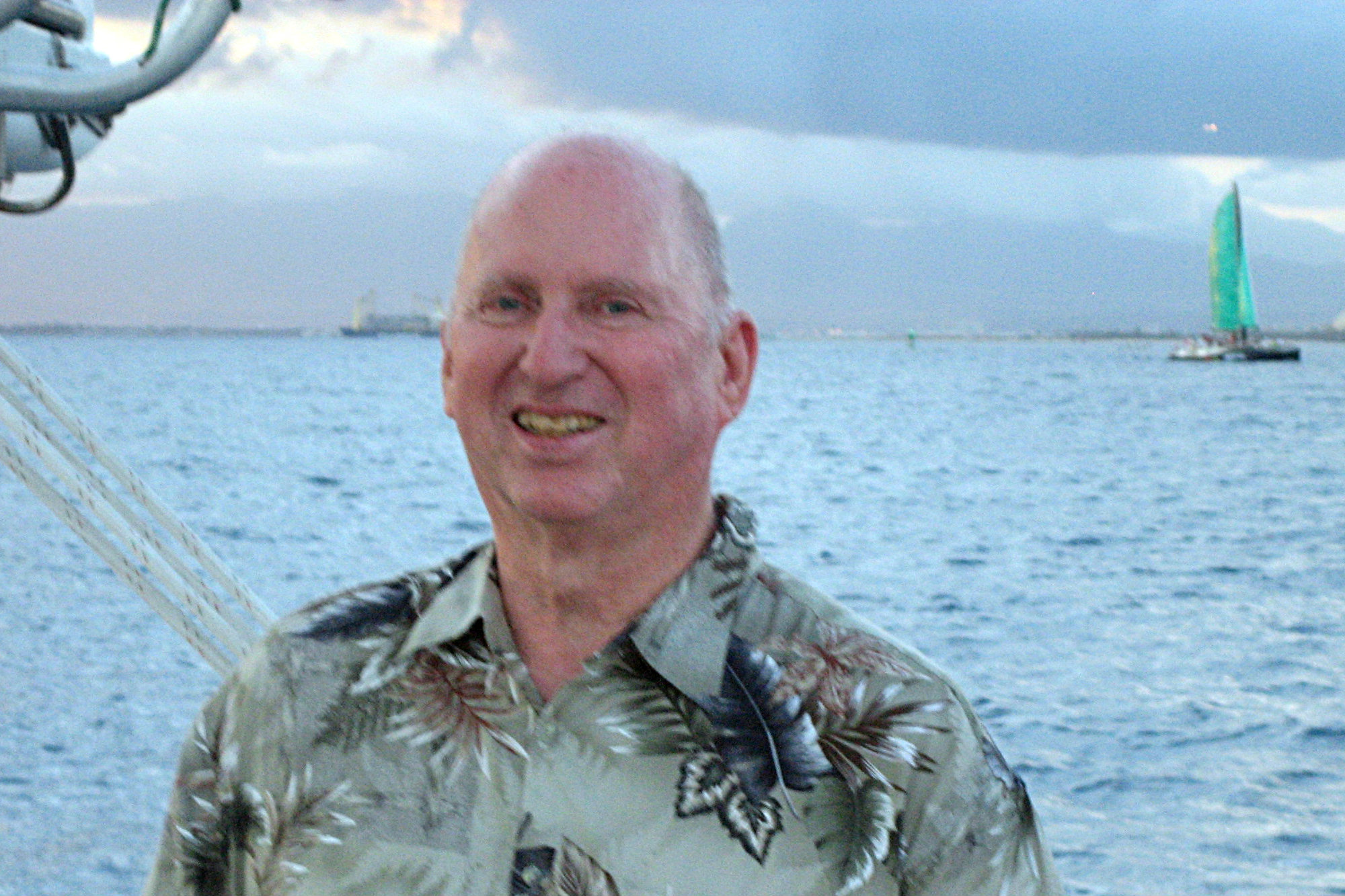 Dick Gross pilots a catamaran in Hawaii.