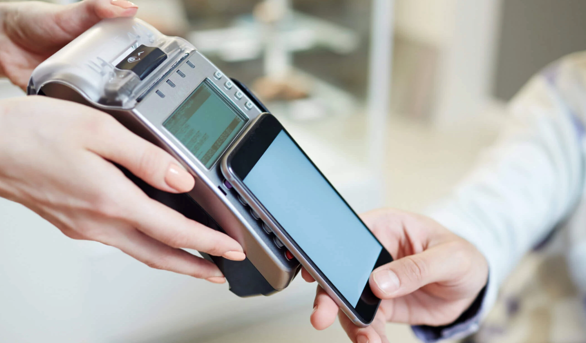 A person paying with a mobile phone