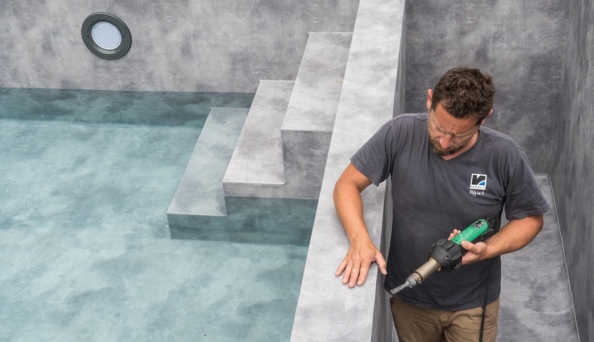 An installer easily welded-in the designer PVC membrane to create the pool’s natural stone-like finish