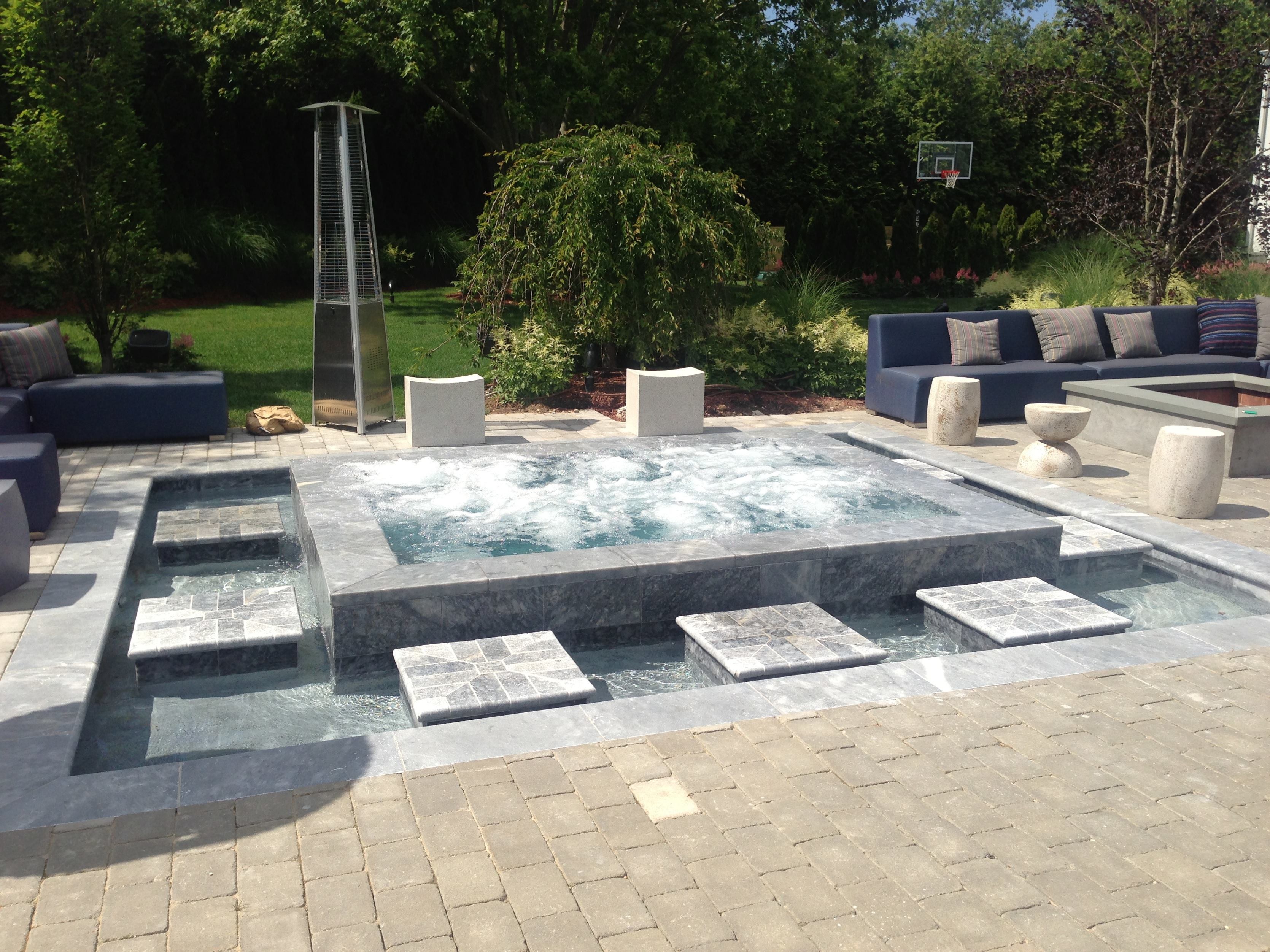 Patrick's Pools of East Quogue, N.Y. earned a Gold award for Stand Alone Spas: Concrete.