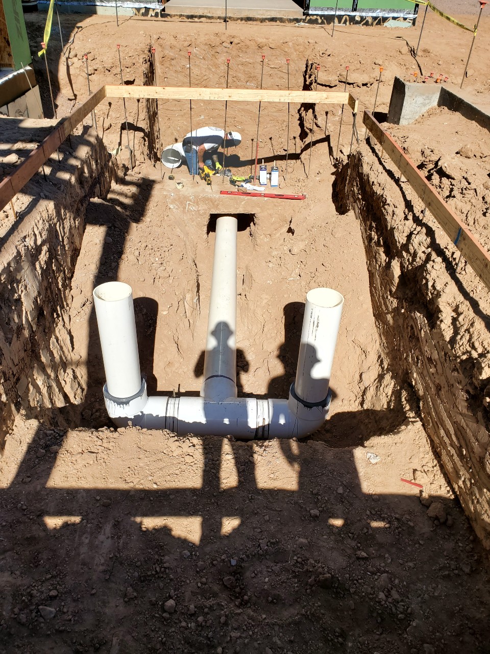 Crews broke ground on the master bedroom swim spa. Here, they can be seen placing the 12-inch plumbing for the current system.