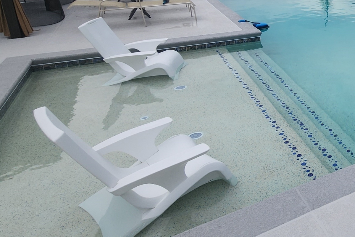 Fifteen-foot sun shelf with bubble designs descends into the pool