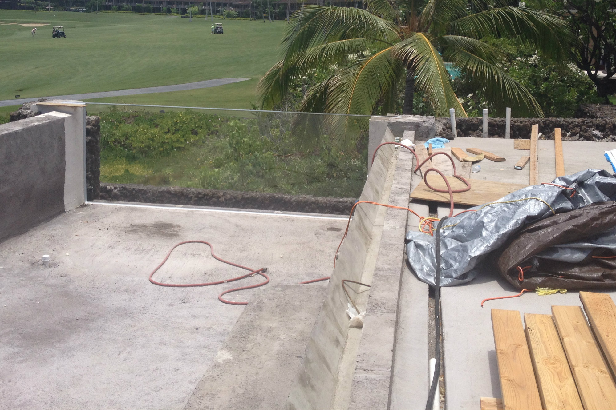 Acrylic expands and contracts more than concrete. Experts generally recommend flexible caulks, grouts and membranes so the panel can move. In the case of vanishing edges, the hydraulic system should probably allow for more water in transit so flows can be adjusted as the wall expands up.