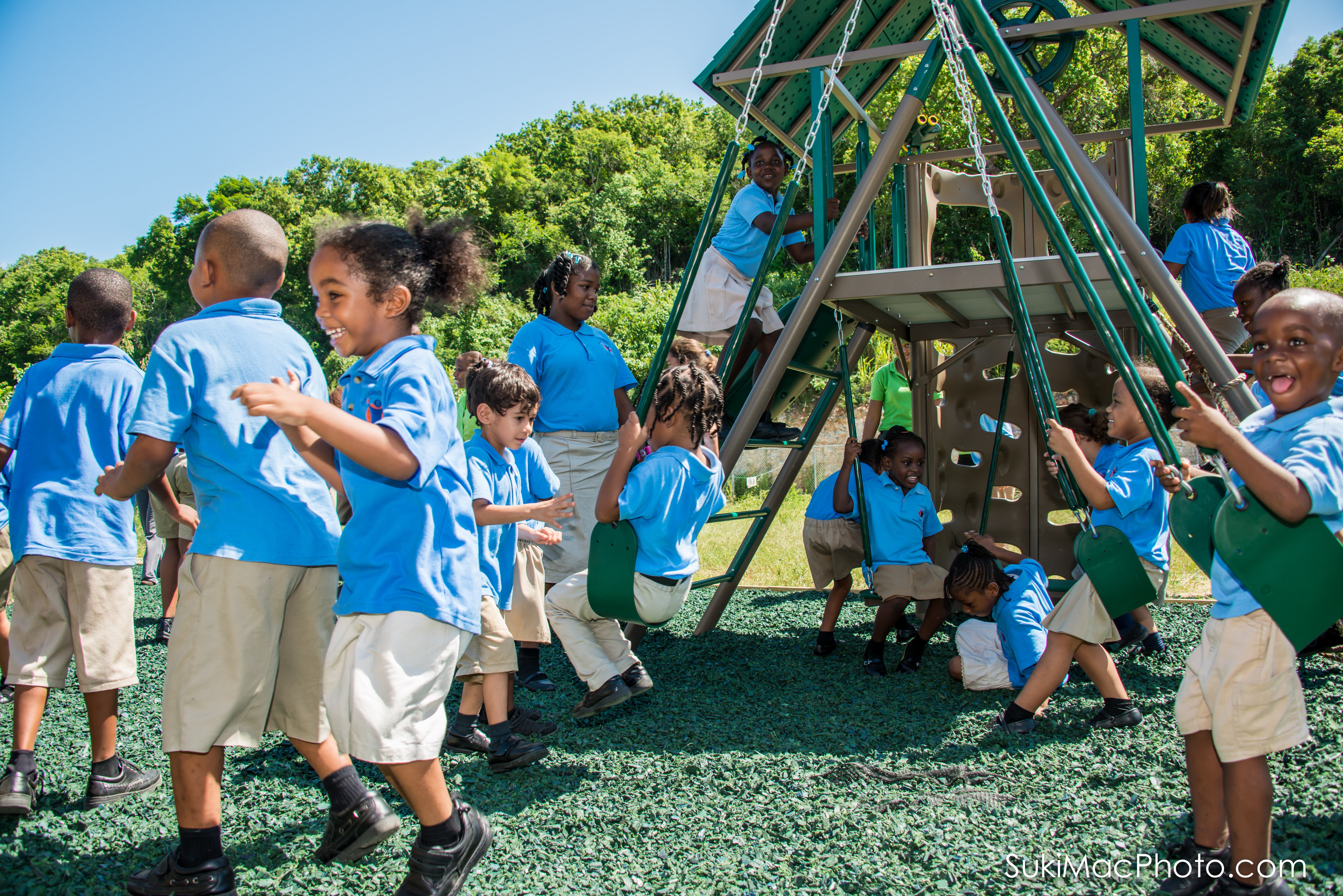 The children celebrate on their new playground.
