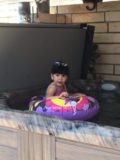 Aubrey enjoys a dip in her new hot tub.