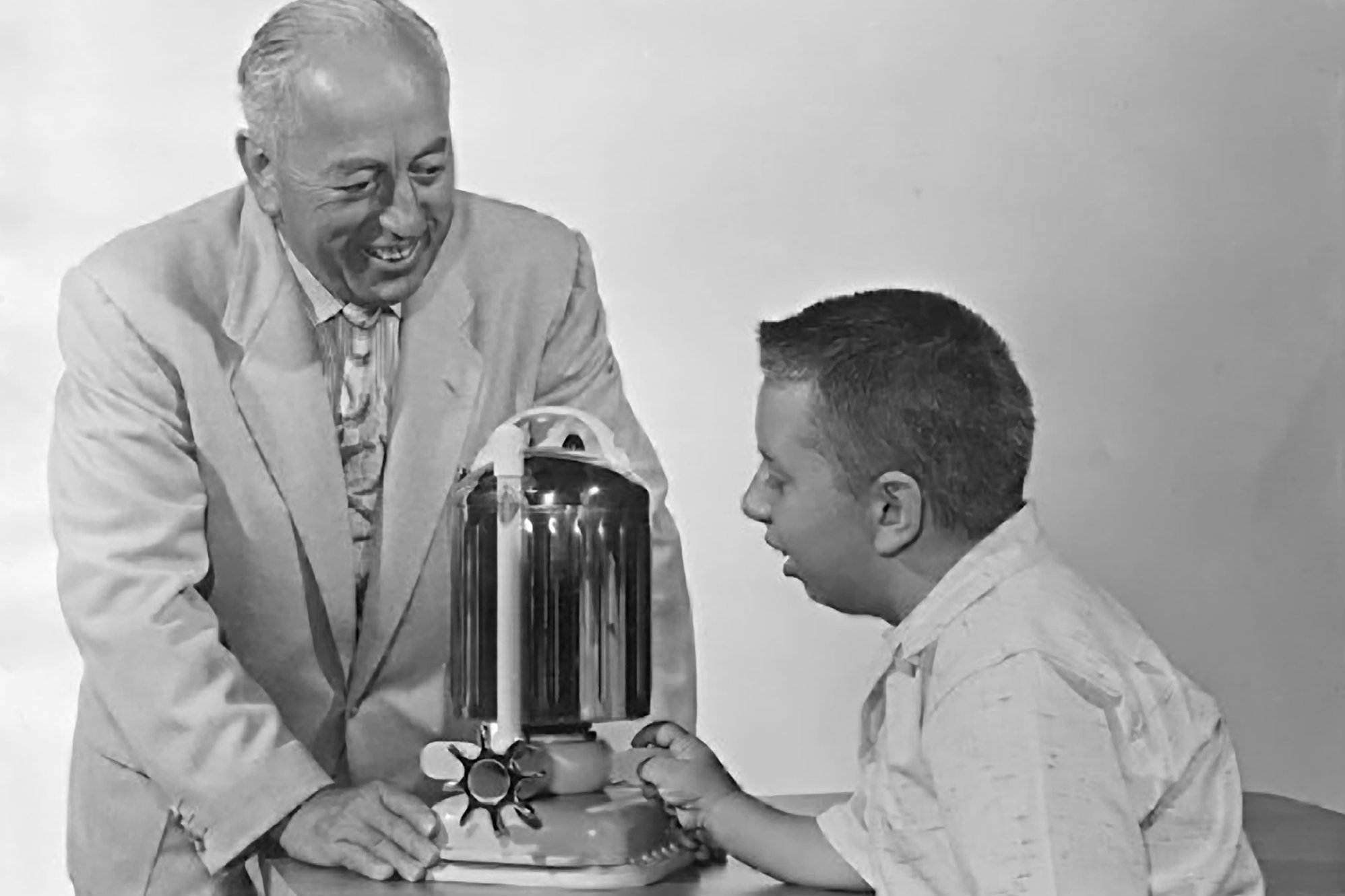 Candido Jacuzzi (standing) and his brothers created this hydrotherapy pump to help alleviate the rheumatoid arthritis of his son, Ken (seated).