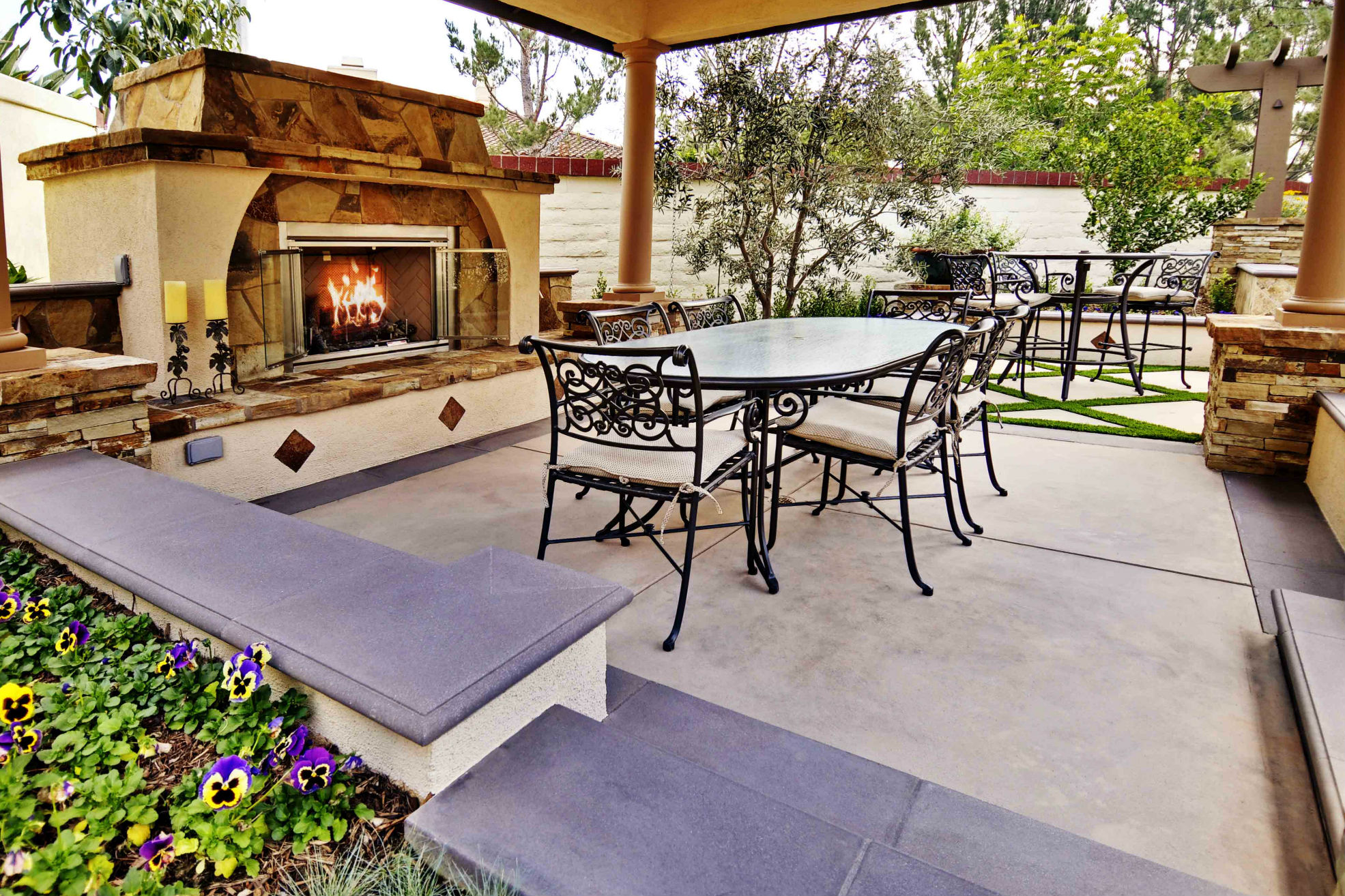 When confronted with the challenge of limited space, Conscious Environments employed another trick that appeared to add more size to this backyard project in California: the designer sank the covered Spanish-style pergola at a lower level than the rest of the area, which makes the space feel bigger.  