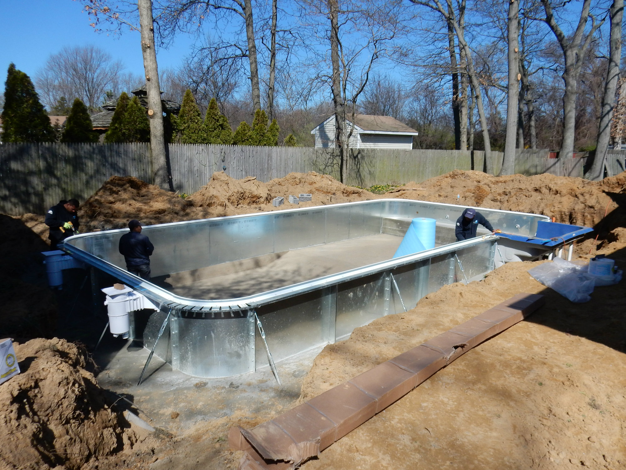 The cause for rejoicing is this 16-by-32-foot, vinyl-liner pool with steel panels and a hard bottom, shown under construction by LIPSA members. Once the backyard transformation is complete and warm weather arrives, it won’t be hard to guess where Tyler and his brother, Nicholas, will be.