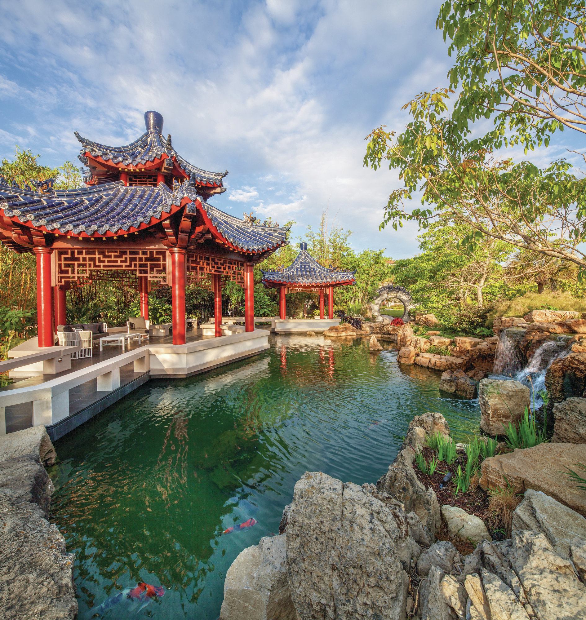 Homegrown substitution: In part, a Chinese garden derives its look from the rock, traditionally a limestone extracted from Lake Tai. Each specimen has a unique shape and character. “It’s very twisted and not anything like the smooth, undulating, weathered rocks that you might see in a Japanese garden,” says David Duensing, whose companies — David B. Duensing & Associates and Aquatic Construction Services, both in Ponte Vedra Beach, Fla. — handled the pond. “This is almost like blasted lava rock. It looks like the rock had popped and ejected material away, [leaving] little cup-shaped areas.” The nearly jagged appearance gives a sense of motion and distinction. But that type of stone is not available in the U.S., and importing it was not viable. In its place, Duensing selected a weathered limestone mined in the Midwest, along the Mississippi River. Its stratification is bulkier than that found in similar varieties in Texas and Oklahoma, creating larger specimens. He chose pieces with the most character.