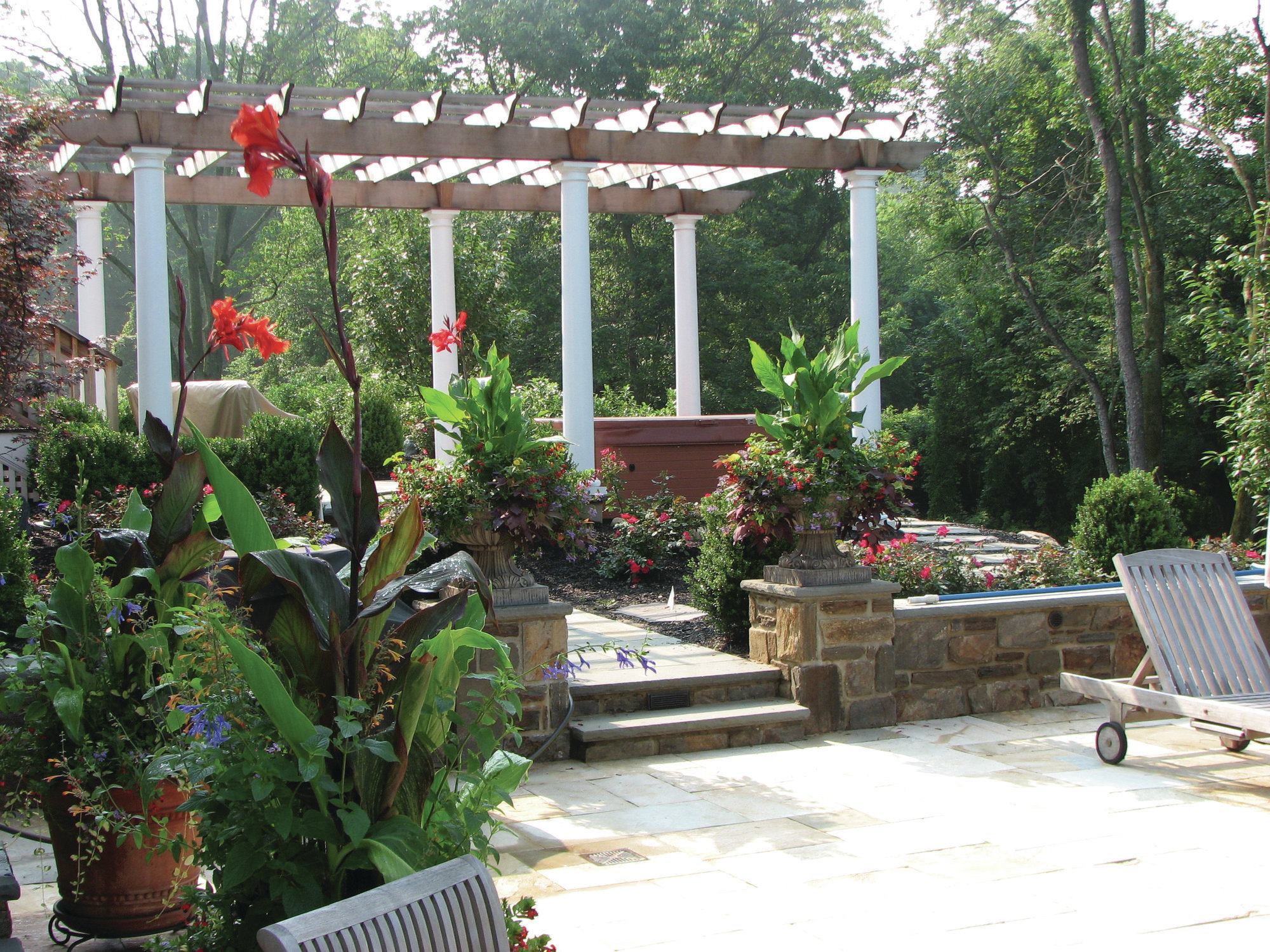 Separate but connected: If there’s an inground pool nearby, many designers prefer to give the hot tub its own space. Plants can lend both privacy and connection to the complete landscape