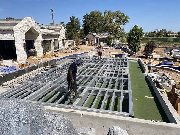 The movable floor during installation, with the artificial turf pad below.