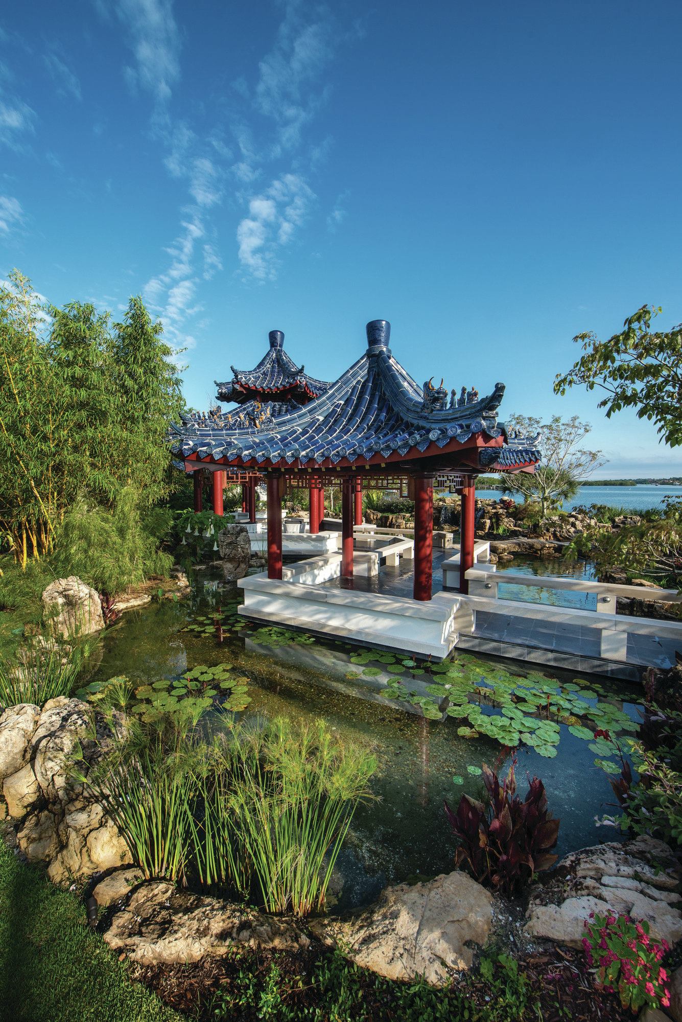 Pavilions of East: Traditional Chinese garden structures were built with a mortise and tenon technique, by which a tongue, or tenon, is inserted into a hole, or mortise. However, that wouldn’t work in this backyard. “Being on the west coast of Florida, in the possible stretches of a hurricane, we wanted to be sure that we didn’t have roof leaks down the road,” says Joe Jannopoulo, president of Synergy Building Corp. “Plus it’s surrounded by the 45,000-gallon koi pond on one side and a bamboo forest on the other, which does not really allow machinery to get close to the structure for repairs.” To make the pagodas as durable as possible while maintaining an authentic look, Jannopoulo constructed the pagodas of poured concrete and veneered them with the same wood and tiles used in the days of the emperors. “The materials were chosen to weather, age, mildew and look symbolic in the terms of a Chinese pavilion,” Jannopoulo says. Traditional pan and cover tiles were ordered from China.