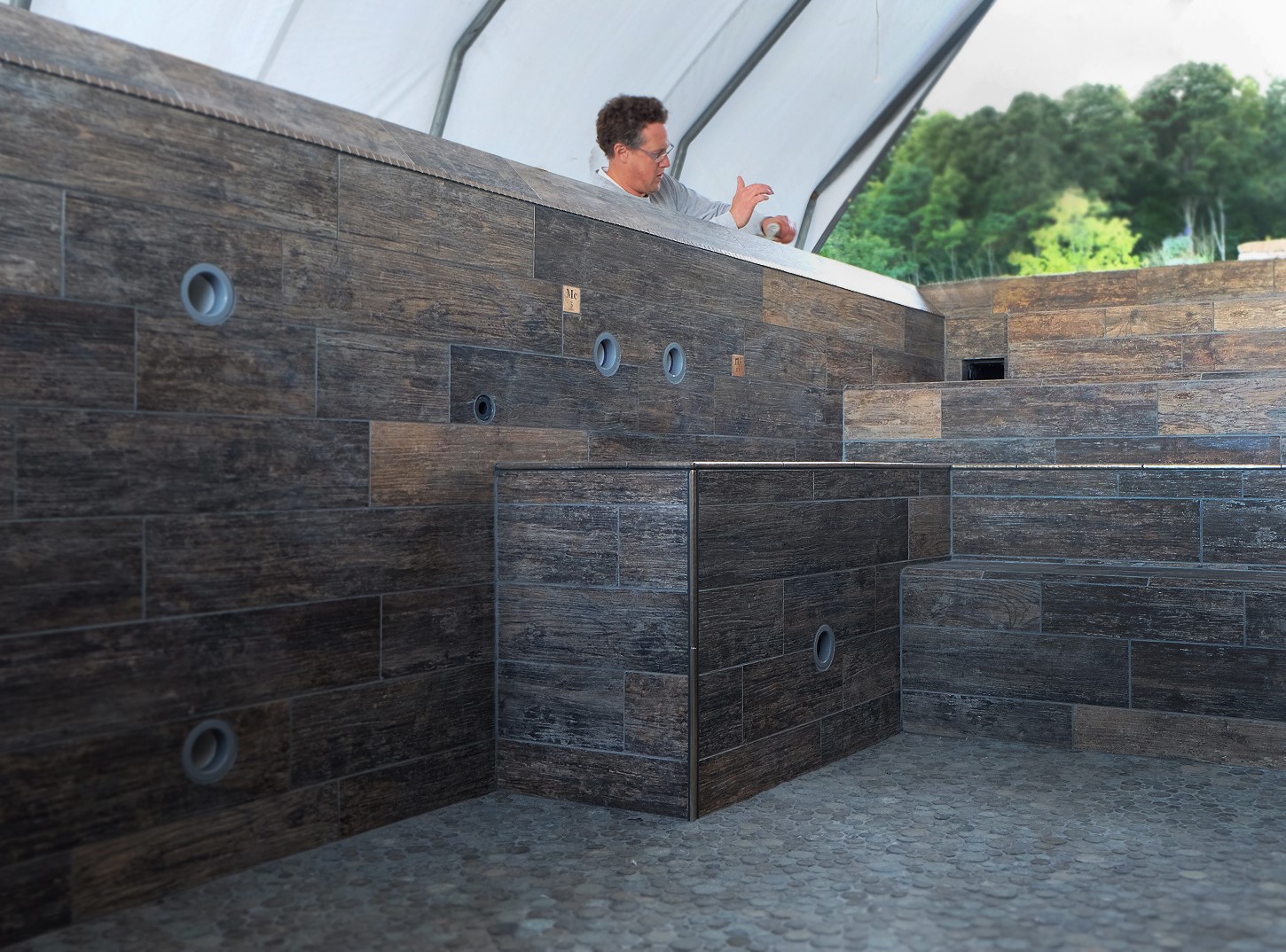 When finishing a whole pool or spa in larger tiles, installers should prepare a thorough layout plan before beginning to set the tile. Consider how you want to address corners and transitions.