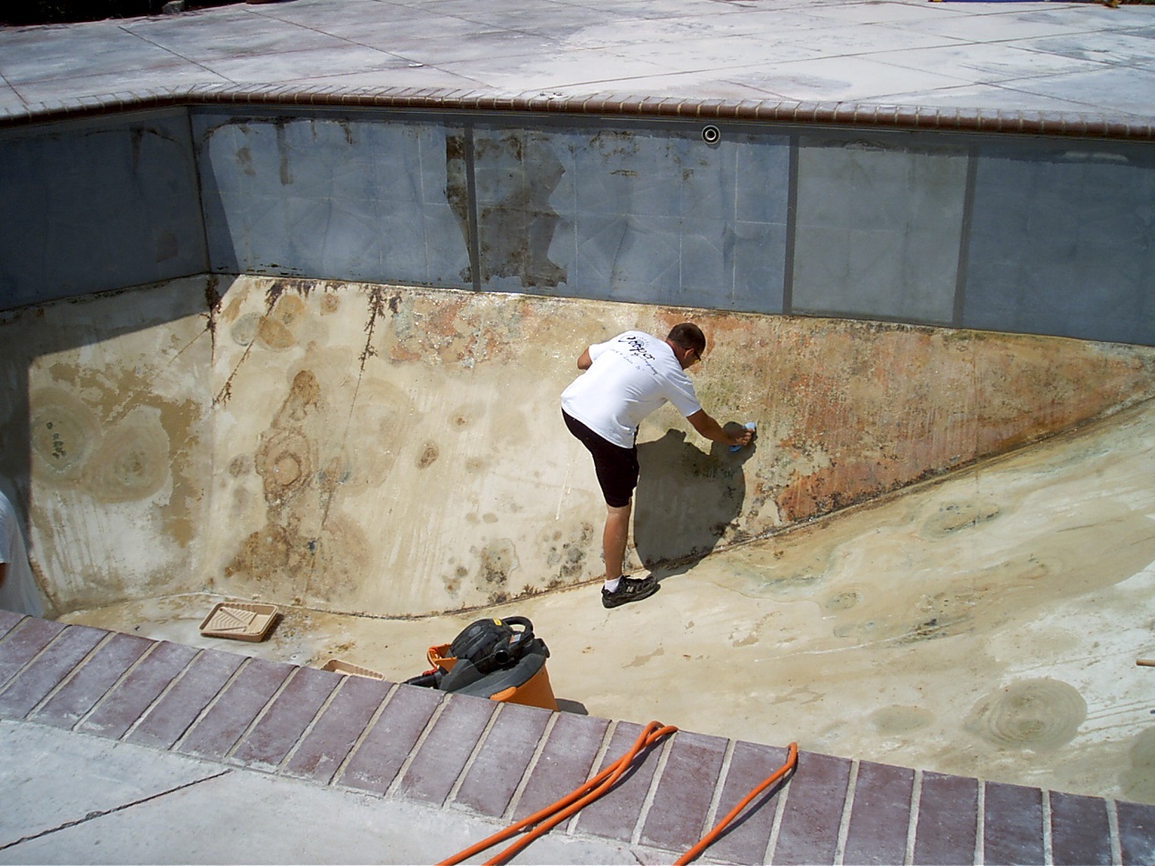 Begin by scraping off and removing all debris and filling in all cracks.  