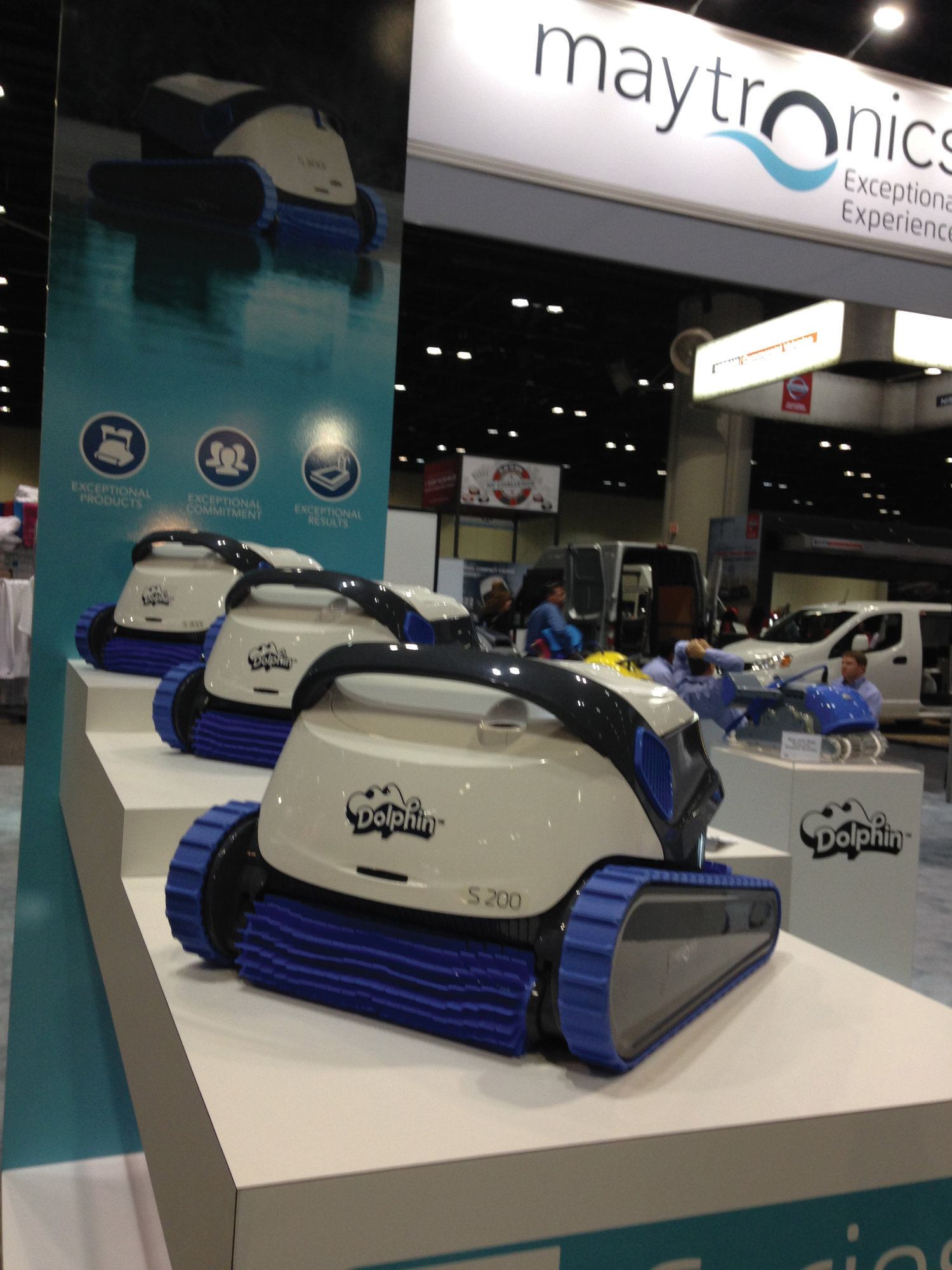 Maytronics displays a line of Dolphin automatic pool cleaners. 