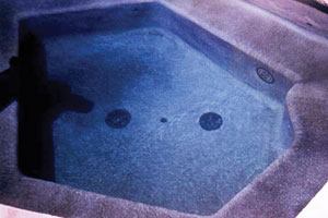 Scale stain: In the photo above, scaling can be seen around the seating shelf of the spa. Not unlike spot etching, scaling may result in stains when combined with metals or other waterborne chemicals. However, when staining on scale is removed, it sometimes reveals a strong, clean surface underneath.