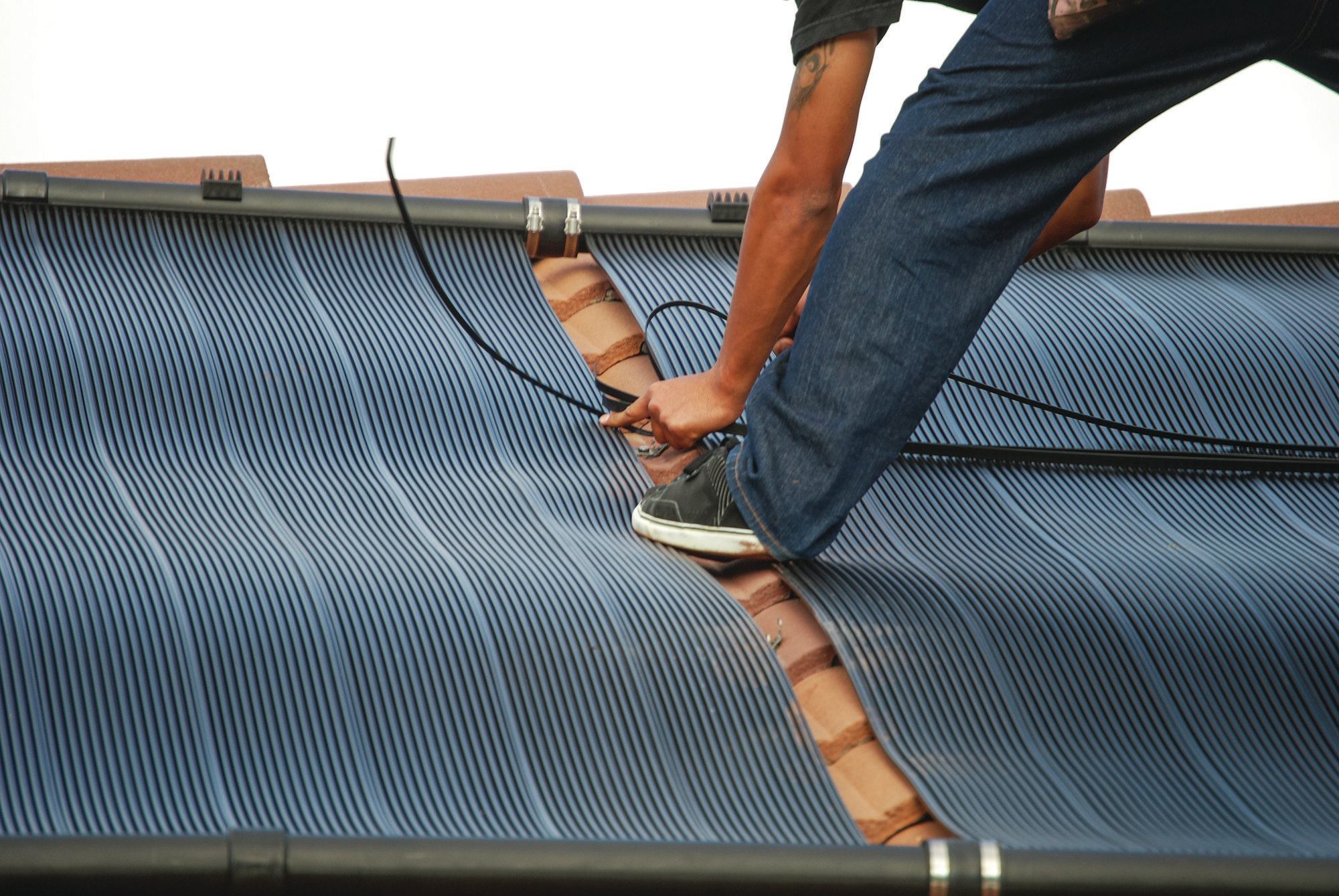 5) Poly-coated stainless steel straps are used to keep the collectors from billowing up in a high wind.