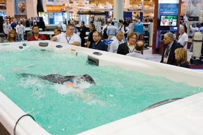 In the

swim: Showgoers could see products, such as this swim spa,

in use at many booths.