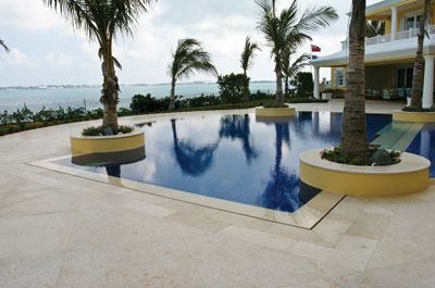 Underwater Coping Perimeter Overflow: An all-tile project also designed by Brian Van Bower includes the underwater coping detail with the patio material on the angled section underwater.