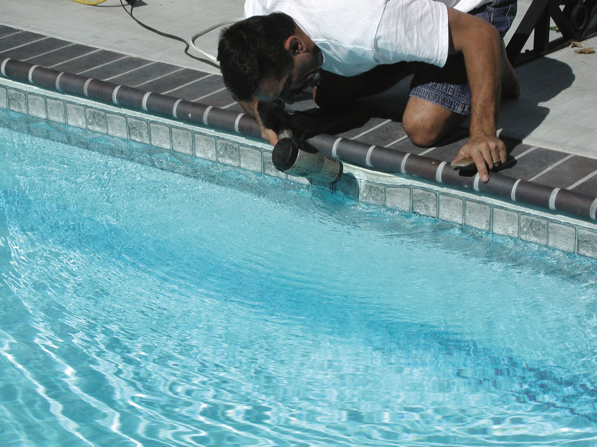 2. Carefully use a blow dryer on the liner section affected by the smiley, to heat up the vinyl and make it more pliable. If it’s a warm day, this step may not be necessary. 