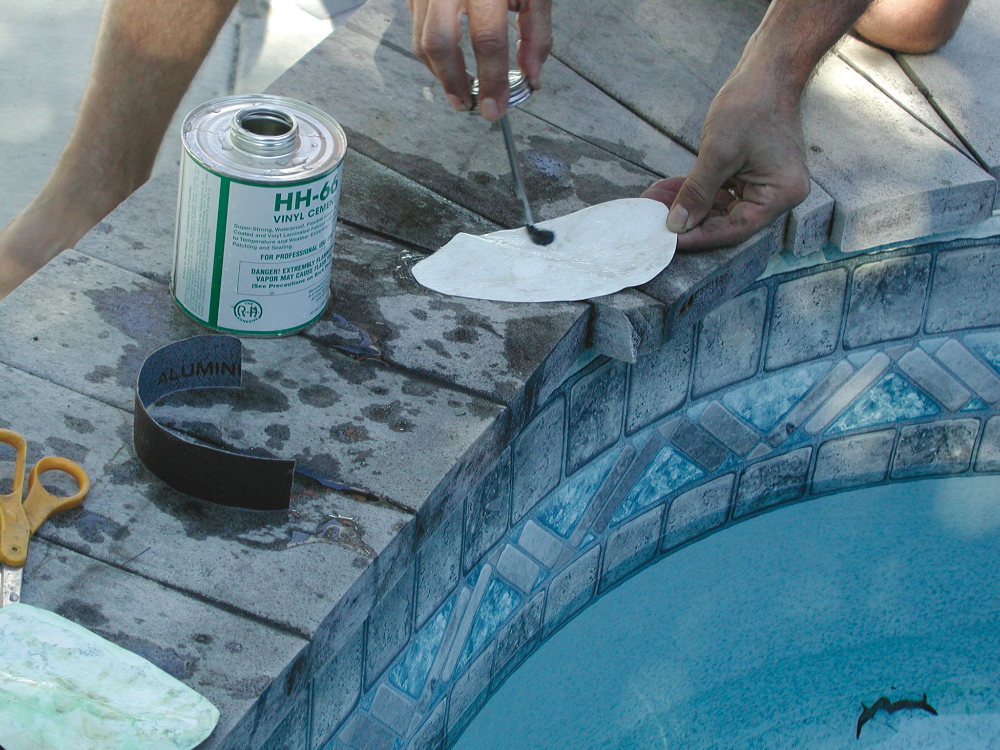 1. Use a sharp knife or razor to remove a patch big enough to completely cover the tear.