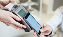 A person paying with a mobile phone